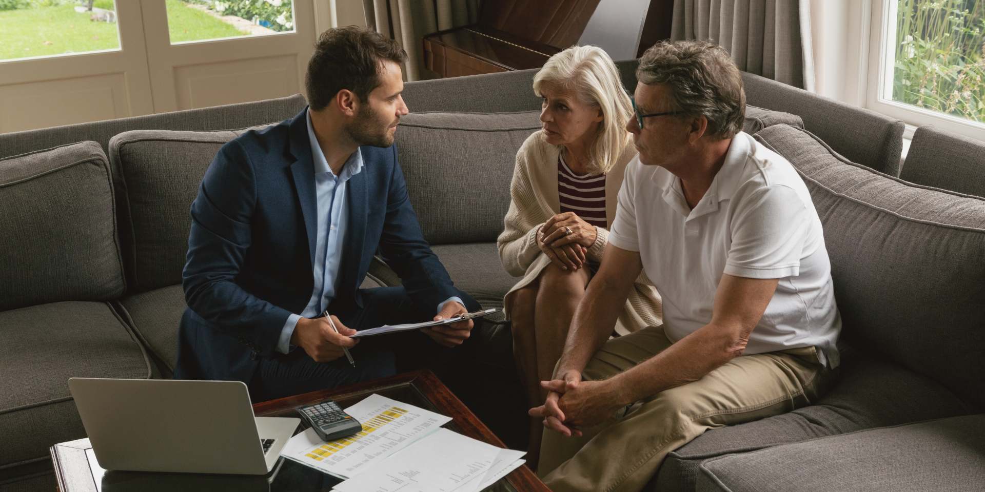 Family reviewing documents with a real estate attorney before buying a home in Nevada.