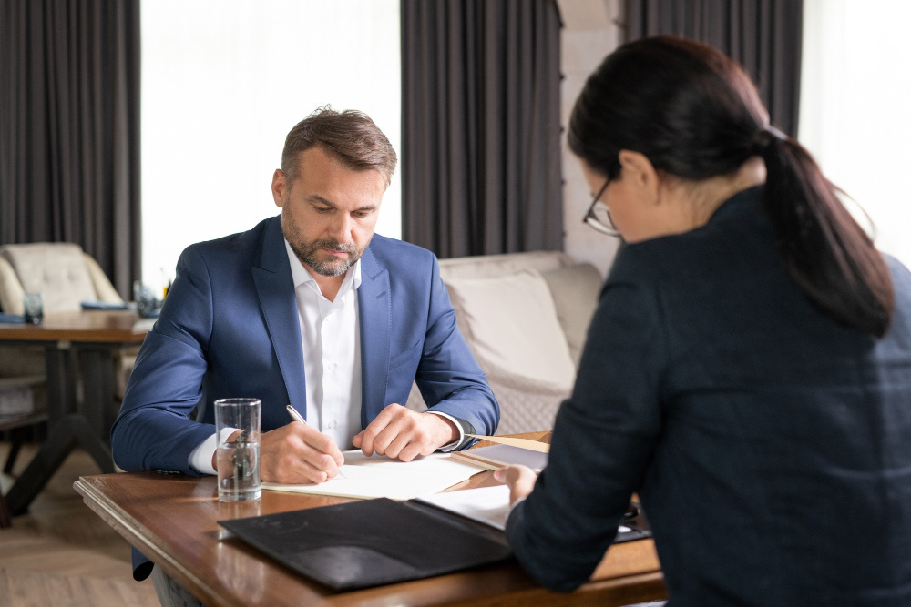 Business owners discussing commercial agreements with their legal advisor.