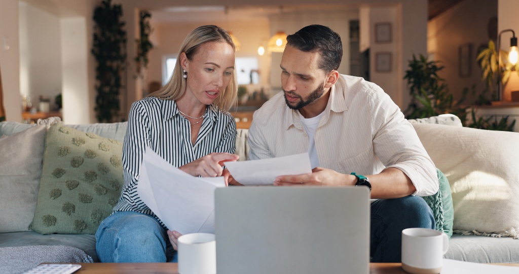 For Sale By Owner (FSBO) home sale in Nevada with homeowner reviewing legal documents before closing.