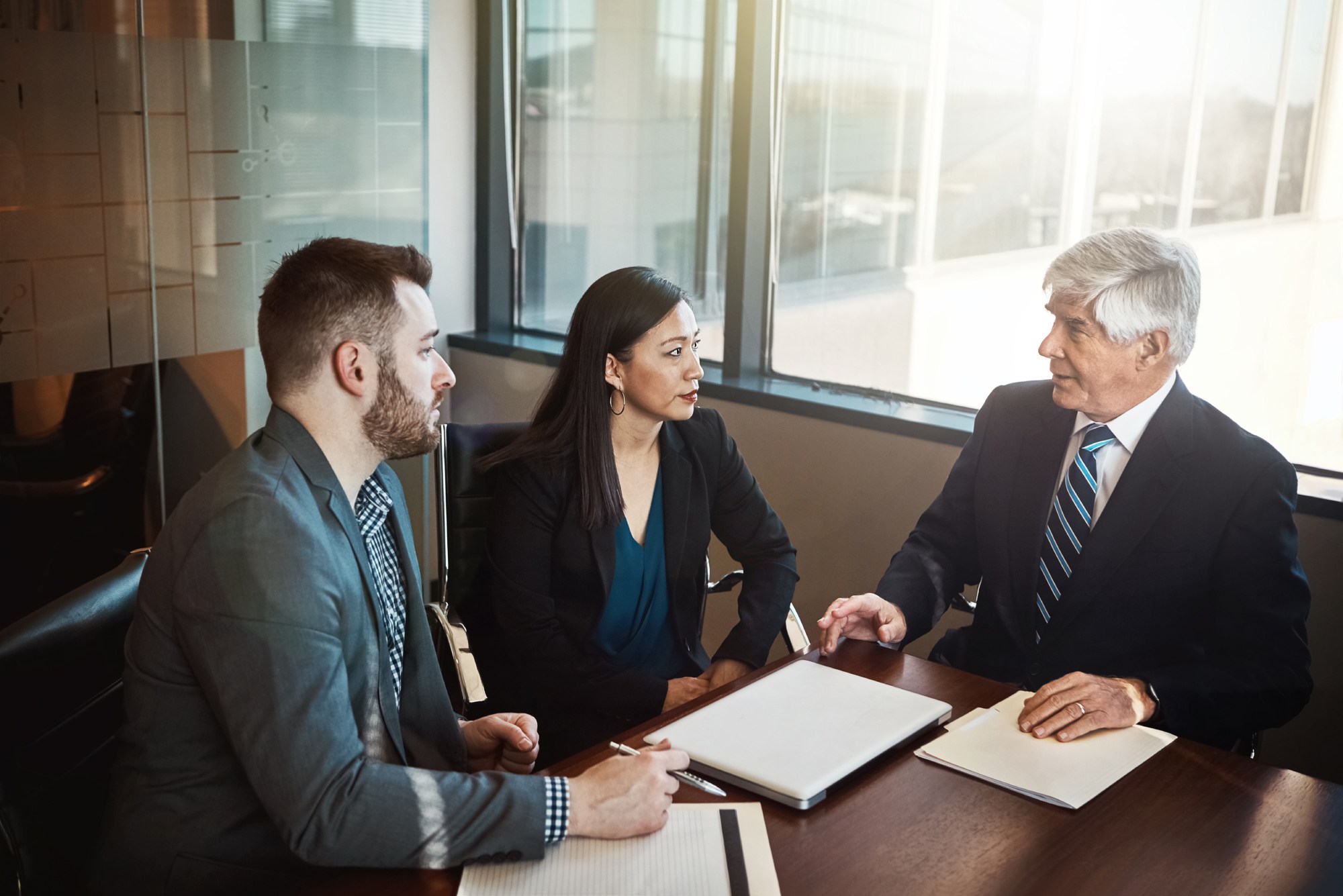 nevada-business-partnership-disputes Business partners discussing a partnership dispute with a Nevada business attorney.