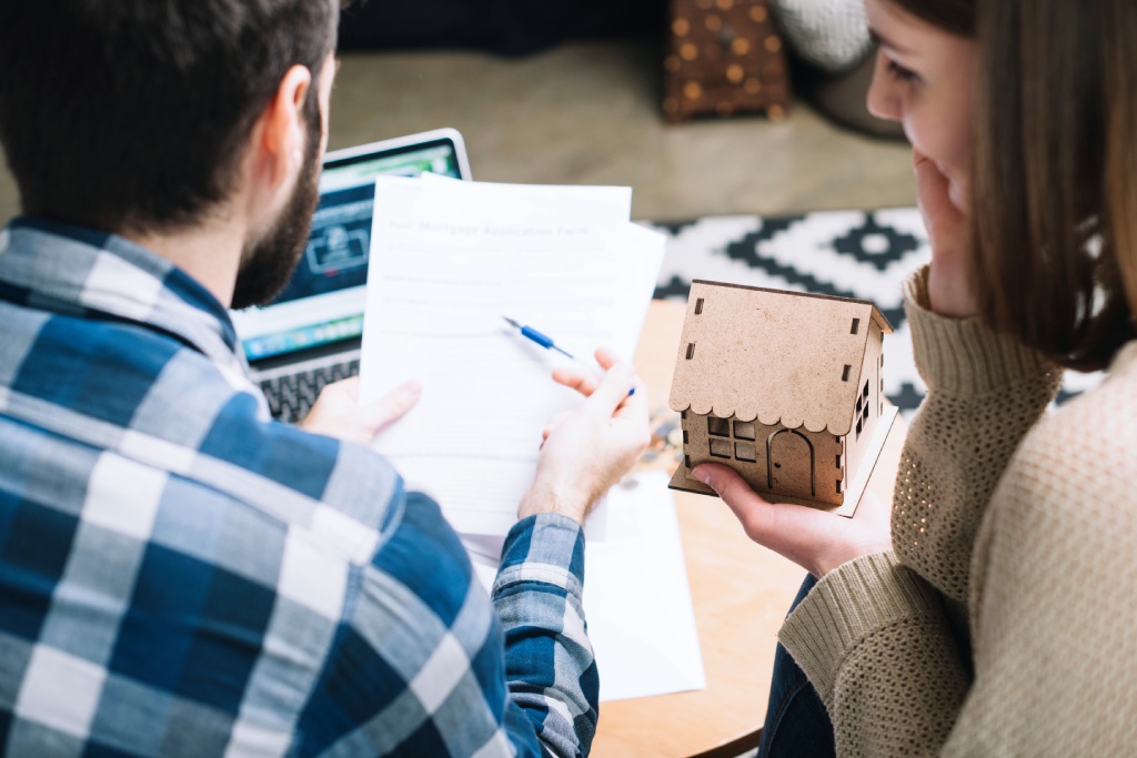 Homebuyer reviewing a Nevada real estate purchase agreement before signing.