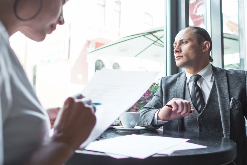 Business owner reviewing an employment contract with legal counsel in Nevada.