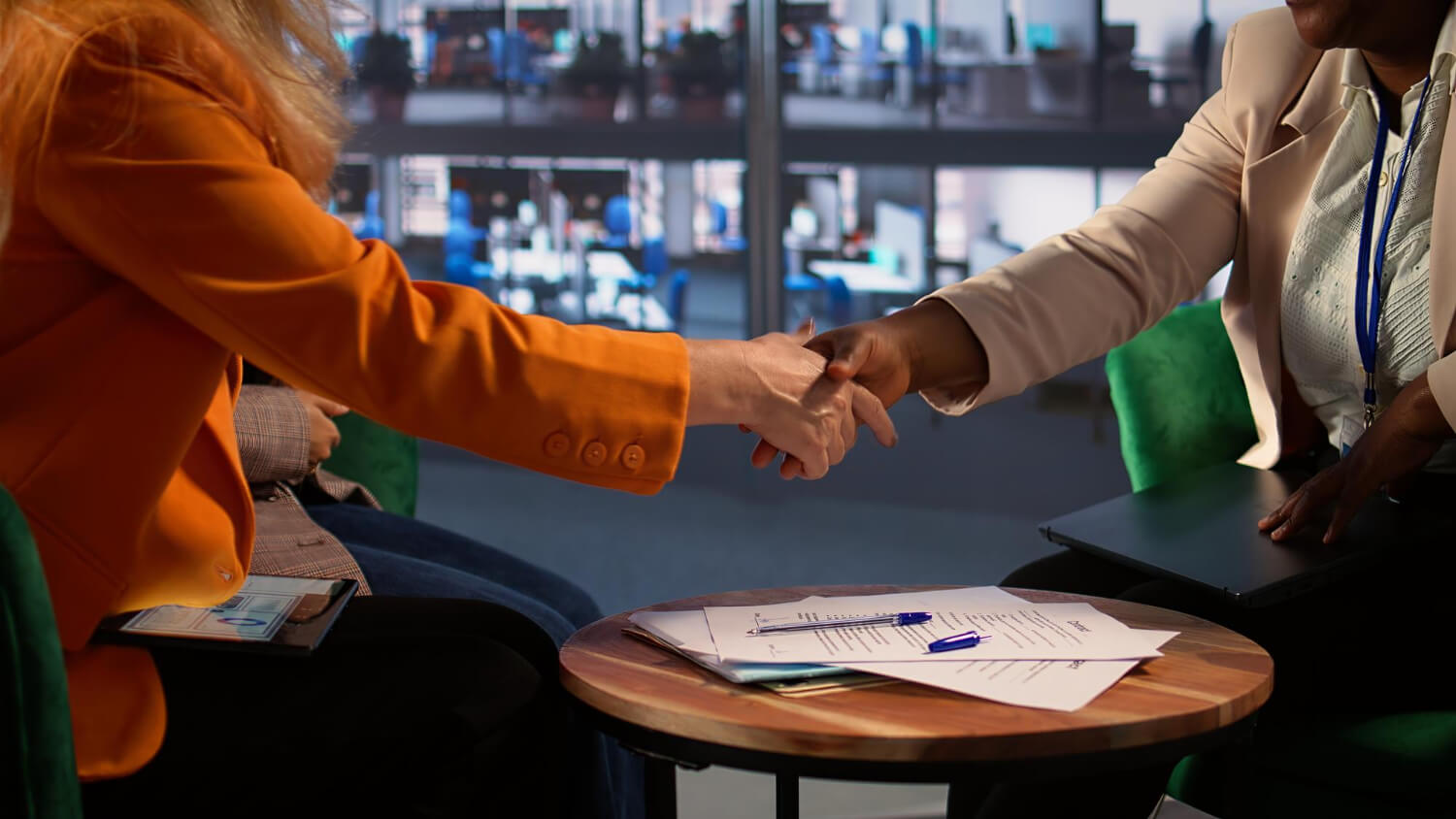 Homebuyer reviewing a Nevada real estate purchase agreement with legal documents.
