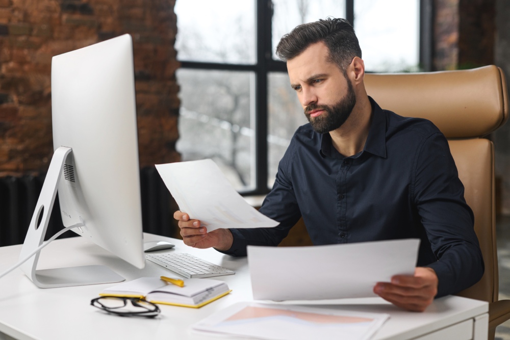 Nevada business owner comparing an LLC and corporation before choosing a business structure.