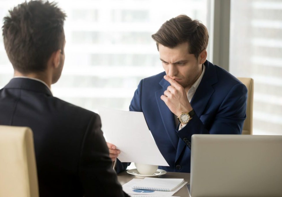 attorney-hiring-guide-nevada-california Attorney explaining legal services during a client consultation in Nevada and California