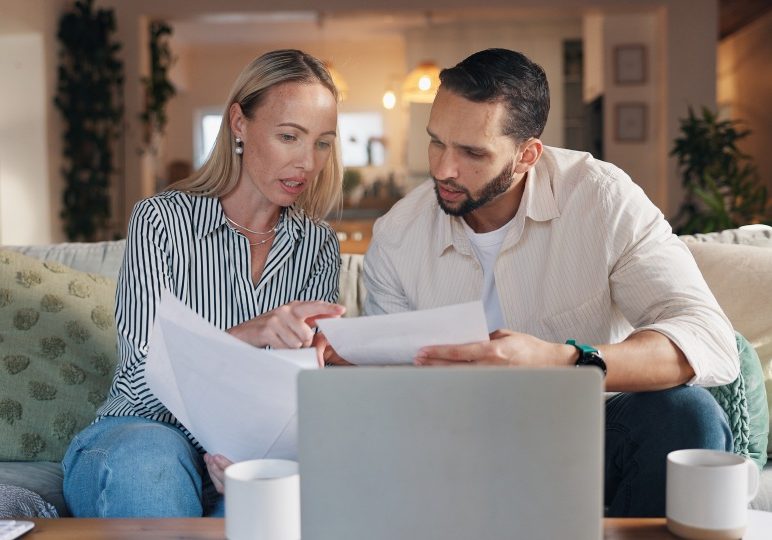 For Sale By Owner (FSBO) home sale in Nevada with homeowner reviewing legal documents before closing.