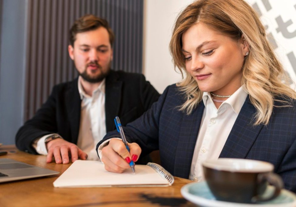 nevada-business-contracts-before-signing Nevada business owner reviewing a business contract before signing an agreement.