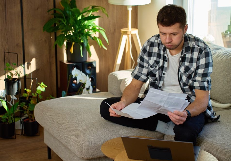 nevada-hoa-fine-violation-notice Nevada homeowner reviewing an HOA violation notice and fine schedule